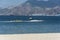 A jet ski pulls a banana boat filled with adventurous tourists. At Barretto Beach, a popular tourist spot near Subic in Olongapo,