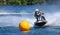 Jet Ski  race competitor cornering at speed creating at lot of spray.