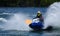 Jet Ski  race competitor cornering at speed creating at lot of spray.