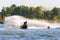 Jet ski racer drives watercraft making turn and splashing while racing at South Russian