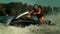 Jet ski rider having fun on waves in slow motion. Man ride jet ski on river