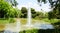 Jet of water in the pond of the MosÃ©n Cinto Verdaguer gardens in Montjuic