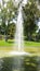 Jet of water in the pond of the MosÃ©n Cinto Verdaguer gardens in Montjuic, Barcelona