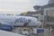 Jetblue airplane offloads luggage at terminal