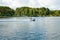 Jetski with people floating on the pond in the countryside