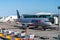 Jetstar Airbus A320 airliner docking at terminal gate on tarmac at Brisbane airport plane ready for unloading and loading of cargo