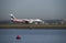 Jetstar airliner with promotional livery on tarmac Sydney airport