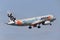 Jetstar Airways Airbus A320 airliner wearing a special `Little Athletics Australia` livery departing Melbourne International Airpo