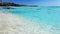 Jetty and boat on tropical beach with amazing water