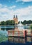 Jetty in canal with cathedral in the background