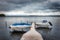 Jetty on a cloudy day with small boats  on Gendarmstien Flensburg fjord, Denmark