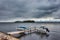 Jetty on a cloudy day with small boats  on Gendarmstien Flensburg fjord, Denmark