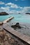 Jetty at Isla de Lobos leading to turquoise ocean and rocks