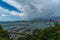 Jetty at Pattaya bay with blue sky and gray clouds covered