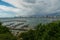 Jetty at Pattaya bay with blue sky and gray clouds covered