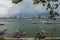 Jetty at Pattaya bay with blue sky and gray clouds covered