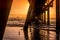 Jetty at The Spit, Queensland at sunrise with sailboat and seagull