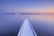 Jetty on a still lake in winter in The Netherlands