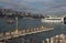 Jetty on the waterfront and floating ship on the Bosphorus on a sunny day in Istanbul, Turkey. Toned image.