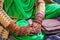 The jeweled and henna decorated hands of a young bride at a village wedding in Jammu and Kashmir