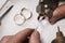 Jeweler fixes stones in a gold ring