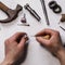 Jeweler fixes stones in a gold ring