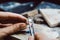 Jeweler setting a precious stone with pincers on a ring