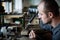 Jeweler silver soldering in his workshop.