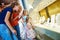 Jewellery shopping. Woman and children excited viewing at shop window