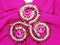 Jewelry brooch with satin and silk background