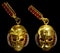 Jewelry gold skull earrings with diamond and red ruby gems.