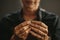 Jewelry maker hands inspecting a silver ring