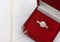 Jewelry wedding ring with diamond in gift box on white