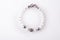 Jewerly bracelet with natural Moonstone semiprecious stones around  white background. top view