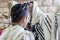 Jewish bar mitzvah , praying in a synagogue with tallit