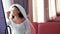 A Jewish bride in a room in front of a mirror applies makeup before the chuppah ceremony, reflected in the mirror