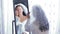 A Jewish bride wears makeup in front of a mirror before the chuppah ceremony
