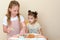 Jewish children dipping apple slices into honey on Rosh HaShanah.