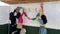 Jewish family decorating the interior of a Sukkah