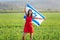 Jewish girl with flag of Israel on amazing landscape in beautiful summer.
