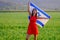 Jewish girl with flag of Israel on amazing landscape in beautiful summer.