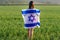 Jewish girl with flag of Israel on amazing landscape in beautiful summer.