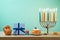 Jewish holiday Hanukkah background with menorah, sufganiyot, gif