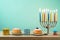 Jewish holiday Hanukkah background with menorah, sufganiyot, gif