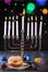 Jewish holiday Hanukkah background. A traditional dish is sweet donuts. Hanukkah table setting a candlestick with