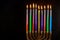 Jewish holiday Hanukkah with hanukkiah menorah on nine candles