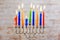 Jewish holiday Menorah Beautiful menorah with burning candles on light blurred background.