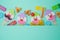 Jewish holiday Purim background with cute paper clowns characters and hamantaschen cookies