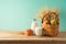 Jewish holiday shavuot background with fruit basket and milk bottle on wooden table