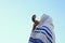 Jewish man blowing the Shofar (horn) of Rosh Hashanah (New Year)